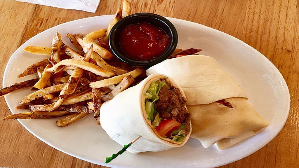 Beef Shawarma Wrap · Your choice of shawarma meat, hummus, tahini sauce, onions, pickles, tomato and cucumber, served with a side of French fries and a side of tahini sauce.