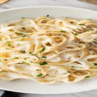 Fettuccine With Alfredo Sauce · Alfredo sauce, fettuccine, parmesan, garlic bread, add chicken with additional charge.