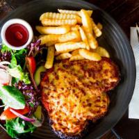 Chicken Parmigiana · Crispy breaded chicken breasts topped with marinara sauce, and mozzarella. served with penne...