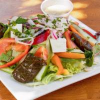 Greek Salad · Crisp lettuce, cucumbers, tomatoes, onions, green peppers, feta cheese, kalamata olives, Dol...