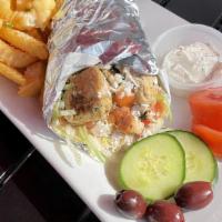 Chicken Souvlaki Sandwich · Grilled skewered chicken in a pita with lettuce, tomatoes, onions, parsley, feta cheese, and...