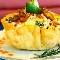 **Taco Shell Salad** · Flour Tortilla Bowl with choice of meat and toppings.
