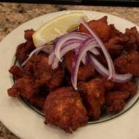 Chicken 65 · Boneless cubes of chicken marinated in house masala and fried.