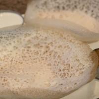 Appam With Coconut Milk · Two South Indian plain pancakes made with fermented rice batter.