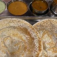 Kal Dosa (2 Nos) · Traditionally made on iron griddle, soft, thick rice & lentil pancake.