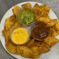 Three Of A Kind · Fresh fried chips , served with in house made salsa, queso and guacamole.