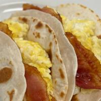 Breakfast Tacos · Served on corn or flour tortilla.