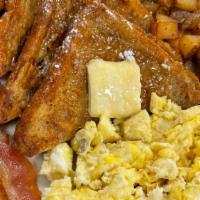 French Toast · 2 French toast served potatoes, 2 eggs and choice of 2 slice of bacon or 2 sausage links.
