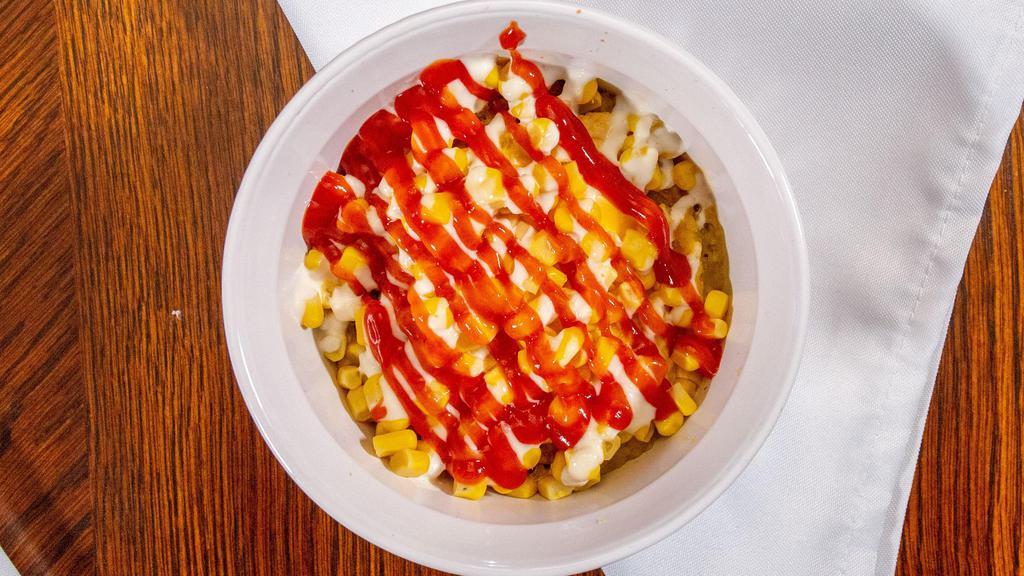 Yaroa · Mash sweet plantain spread  topped with ground beef, mozzarella  cheese, corn , ketchup and mayo.