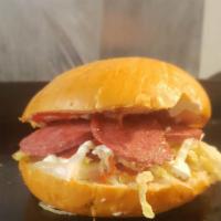 Riki Taki · Salami, cabbage and boiled egg , tomatoes slices topped with ketchup and mayo.(español)Salam...
