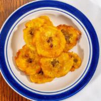 Tostones  · Side of Fried Plantains /
Platano Fritos