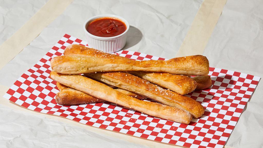 Bread Sticks · 2 pieces baked bread sticks with side of marinara sauce.