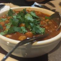 Chana Masala · Chickpeas cooked with garlic, ginger and exotic, spices.