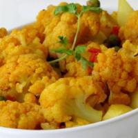 Aloo Gobi · Fresh cauliflower and potatoes cooked with tomatoes and spices.