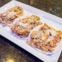 Spicy Street Tacos · Three flour tortillas topped with your choice of grilled all natural chicken or pork carnita...