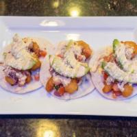 Shrimp Taco · Flour tortillas stuffed with flash fried seasoned shrimp, topped with house made pico de gal...