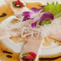 Yellowtail Jalapeno (5) · Raw or Undercooked. Spicy. Yellowtail sashimi with yuzu sauce, jalapeno, scallion and masago.