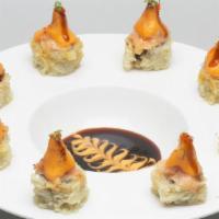 Volcano · Spicy. Shrimp and crab stick tempura; topped with scallop and Alaskan king crab mixed with s...