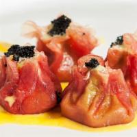 Tuna Dumpling · Spicy. Raw or undercooked. Tuna, avocado, tempura flakes, tobiko and lobster salad, served W...
