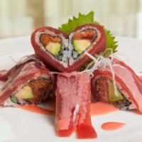 Sweet Heart Roll · Spicy. Raw or undercooked. Spicy crunch tuna, avocado, tobiko and tuna, served With strawber...