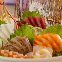 Sashimi Regular (16 Pcs) · Raw or undercooked. 
 Chef's choice of assorted fillets of raw fish and octopus, served with...