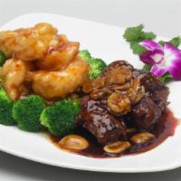 Steak & Shrimp · Seared tenderloin steak With black pepper sauce and jumbo shrimp in general tso's sauce.