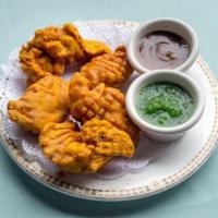 Chicken Pakoras · Strips of chicken breast dipped in spiced chickpea batter and the deep fried.