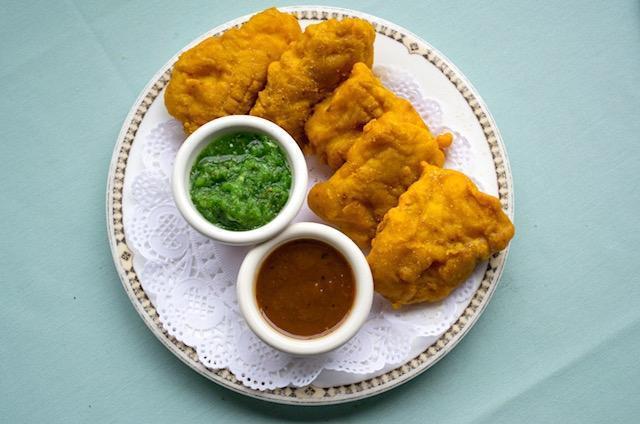 Fish Pakoras · Strips of fish dipped in spiced chickpea batter and then deep fried.