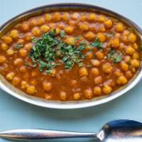 Chana Masala · Garbanzo beans(chickpeas) cooked in a delicate curry and tomato sauce with spices.