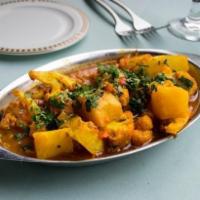Aloo Gobi · Potatoes and cauliflower florets, suateed with indian spices.