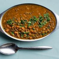 Dal Makhani · Black Lentils and kidney beans, cooked in a delicately buttery sauce.