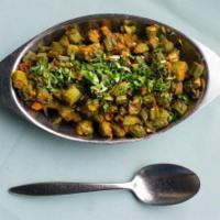 Bhindi Masala · Cut pieces of okra sauteed with cumin seeds, onion, ginger, garlic, and indian spices.