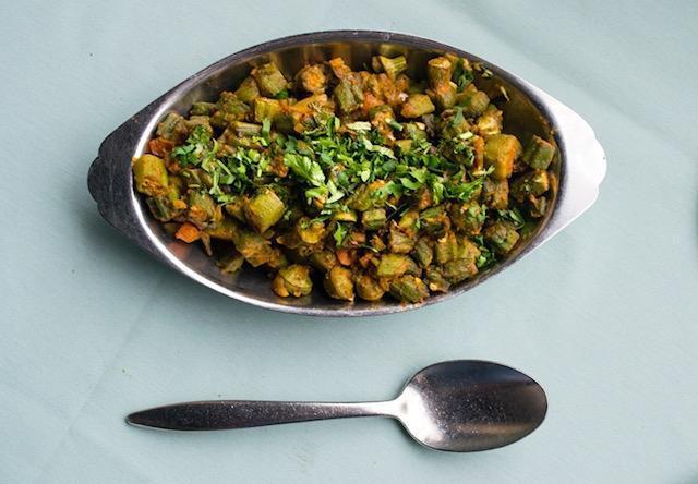 Bhindi Masala · Cut pieces of okra sauteed with cumin seeds, onion, ginger, garlic, and indian spices.