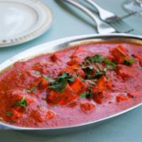 Paneer Tikka Masala · Paneer pieces cooked in a creamy tomato sauce