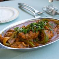 Chicken Karahi · A stir fry of onions and bell peppers blended with a light curry sauce.