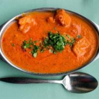 Shrimp Tikka Masala · A creamy tomato sauce, blended with exotic herbs and spices.