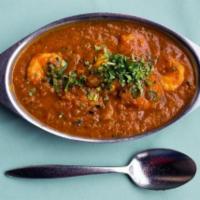 Shrimp Curry · A traditional, onion based gravy, blended with an array of spice.
