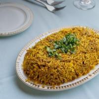 Chicken Biryani · Chicken cooked in a seasoned curried rice dish. Accompanied with a side of Raita.