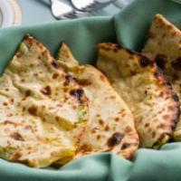 Aloo Paratha · Shredded potatoes and spices, stuffed into a paratha.