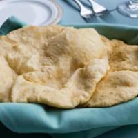 Bhatura · Two small, fluffy, deep fried, leavened bread made with White flour.