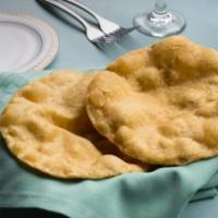 Poori · Two small, fluffy, deep fried, leavened bread made with wholewheat flour.