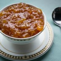 Mango Chutney · Pieces of cooked mangoes simmered and then cooled into a thick, sweet sauce.