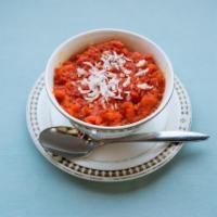 Gajar Halwa · Grated carrots cooked in milk, cardamom and brown sugar.