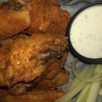 Buffalo Chicken Wings · Tossed in your choice of buffalo (mild, hot or garlic parmesan), honey sriracha, BBQ or mang...