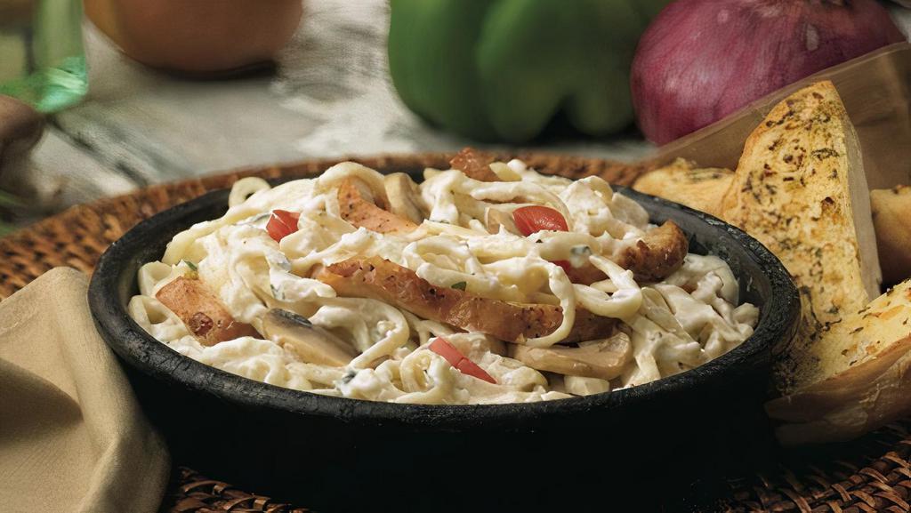 Hometown Alfredo · Linguini baked in creamy alfredo sauce with fresh mushrooms and tomatoes