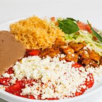 Enchiladas Rojas / Red Enchiladas · Tres enchiladas en salsa roja de Guajillo con pollo o queso fresco, cubierto con papas y cho...