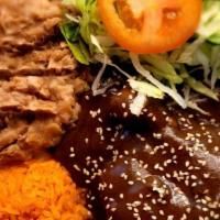 Platillo De Moles / Mole Plate · Nuestro mole tradicional mexicano servido con pollo. / Our Mexican traditional mole served w...