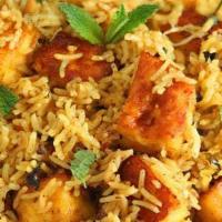 Paneer Tikka Curry Biryani · Veggie biryani with paneer tikka curry on it
