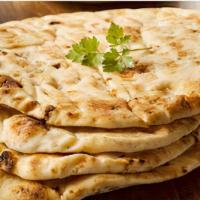 Butter Naan · A large butter naan baked to perfection in tandoor.