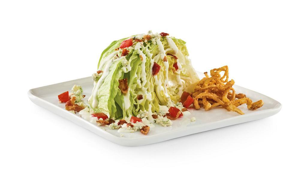 Classic Wedge Salad · Bleu cheese and bacon crumbles, crispy onion straws, diced tomatoes, and ranch. 420 cal.